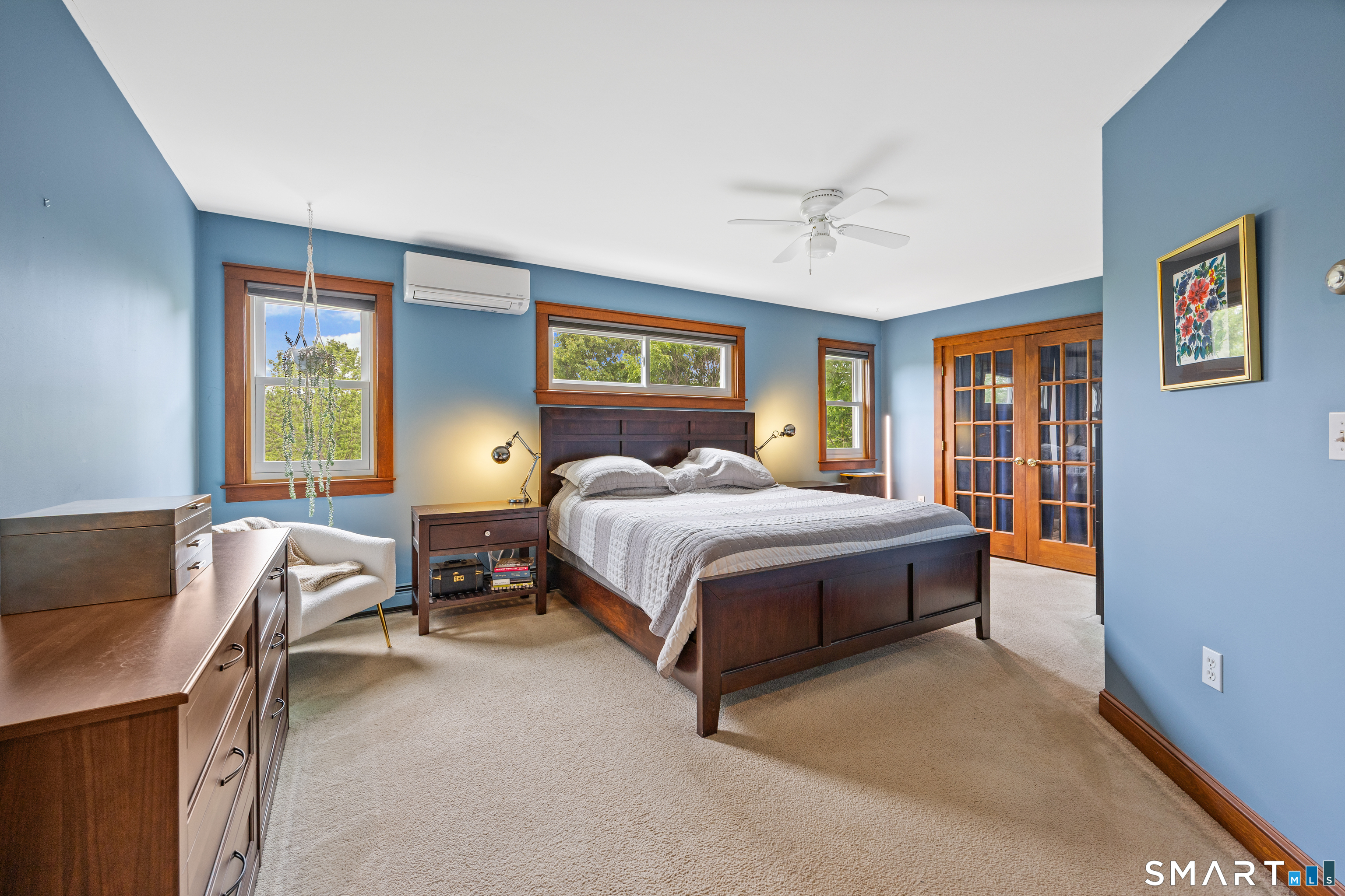 694 Millbrook Road Middletown, CT 06457 - Photo 20 of 34 a bedroom with a bed and wooden floor