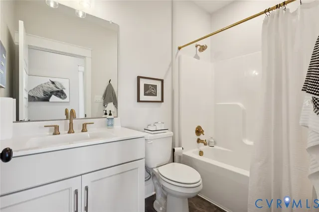 a bathroom with a sink toilet tub and shower