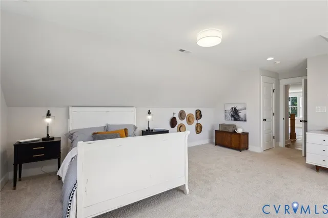 a bathroom with double sink a toilet a shower and a mirror