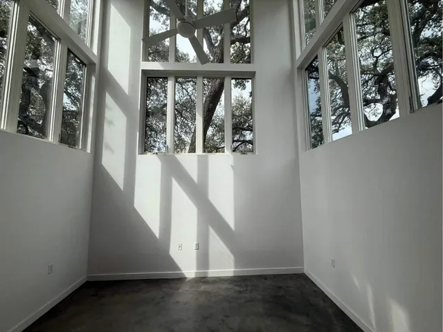 a view of a livingroom with a kitchen