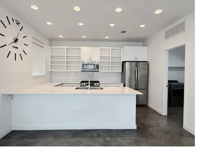 a bathroom with cabinets and sink