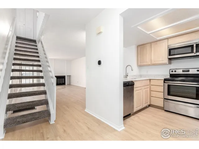 a kitchen with cabinets and a stove