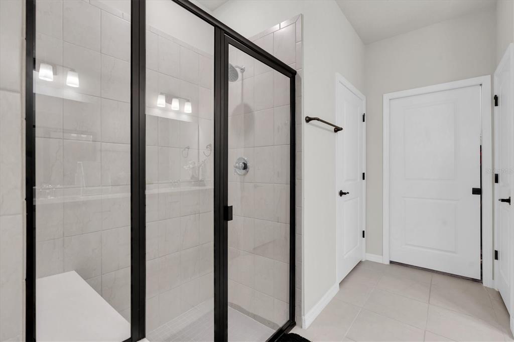 6352 Mooring Line Circle Apollo Beach, FL 33572 - Photo 21 of 33 a bathroom with a glass door shower