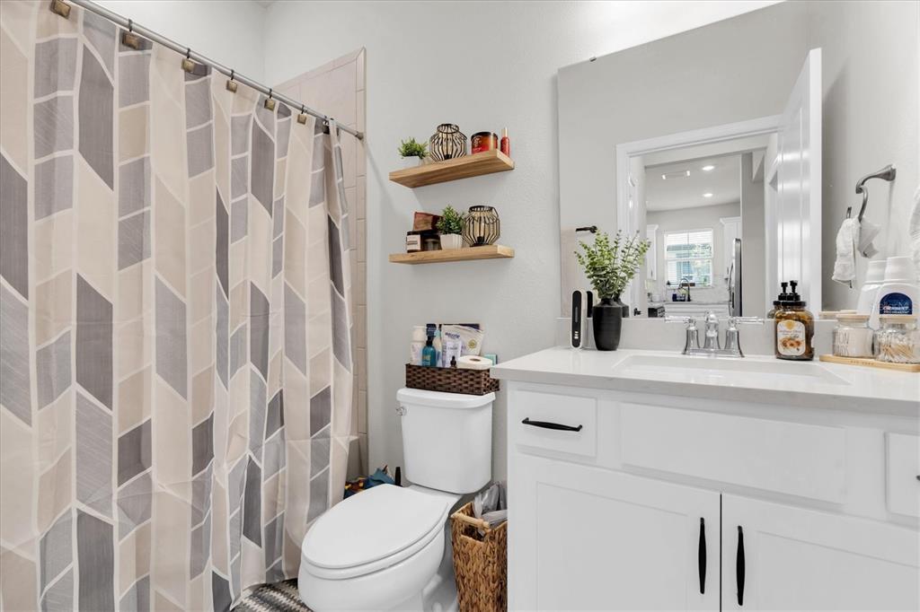6352 Mooring Line Circle Apollo Beach, FL 33572 - Photo 25 of 33 a bathroom with a sink a toilet and a mirror