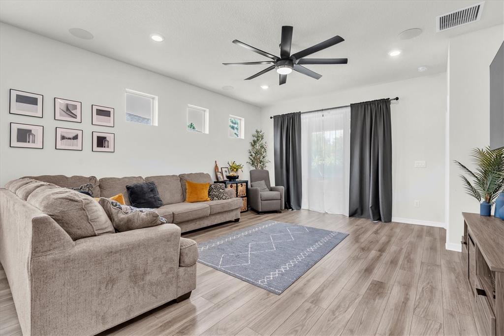 6352 Mooring Line Circle Apollo Beach, FL 33572 - Photo 6 of 33 a living room with furniture and a wooden floor