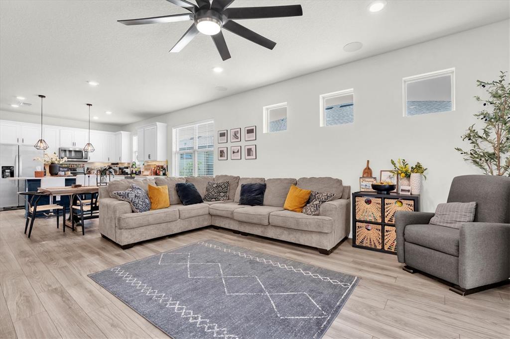 6352 Mooring Line Circle Apollo Beach, FL 33572 - Photo 10 of 33 a living room with furniture and a wooden floor