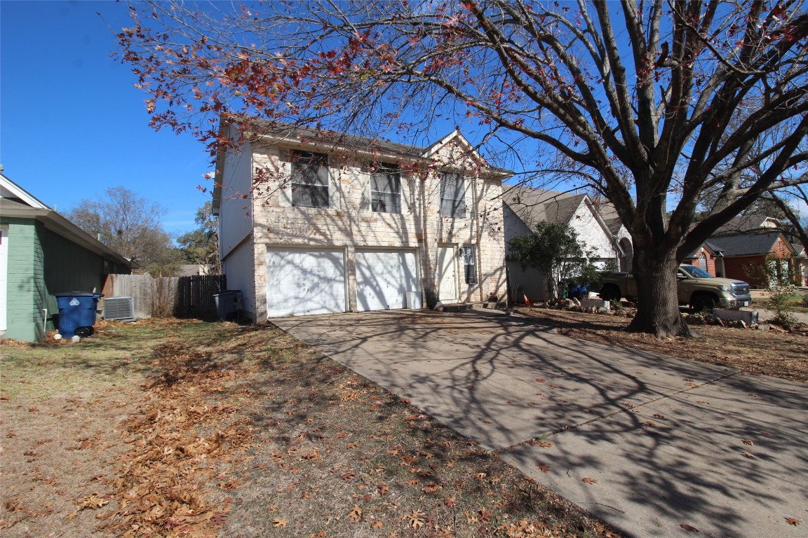 808 Angleton Cove Austin, TX 78748 - Photo 1 of 17 View of front of home with driveway and an attached garage