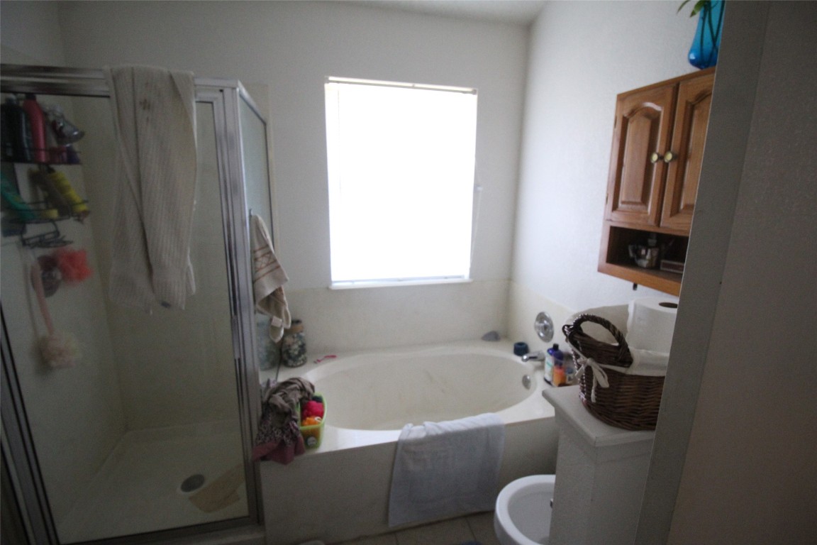 808 Angleton Cove Austin, TX 78748 - Photo 13 of 17 Full bath with a garden tub and a shower stall