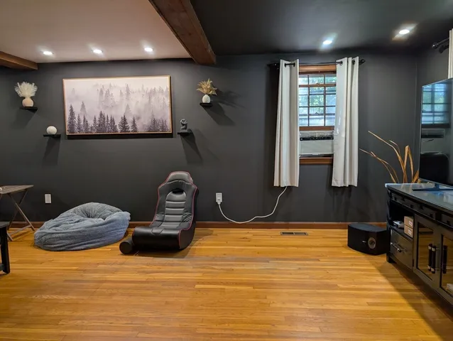 a room with furniture and a flat screen tv