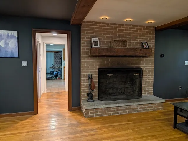 a view of fireplace and wooden floor