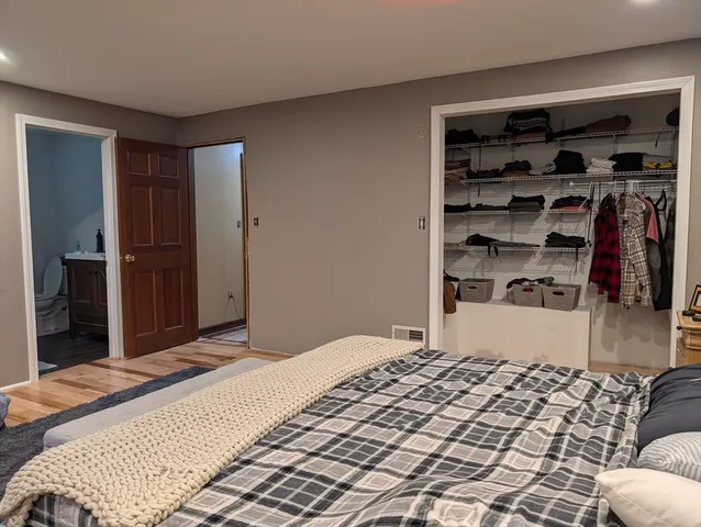 a living room with a bed and furniture