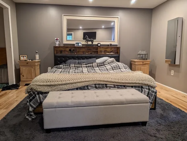 a bathroom with a toilet a sink and a window