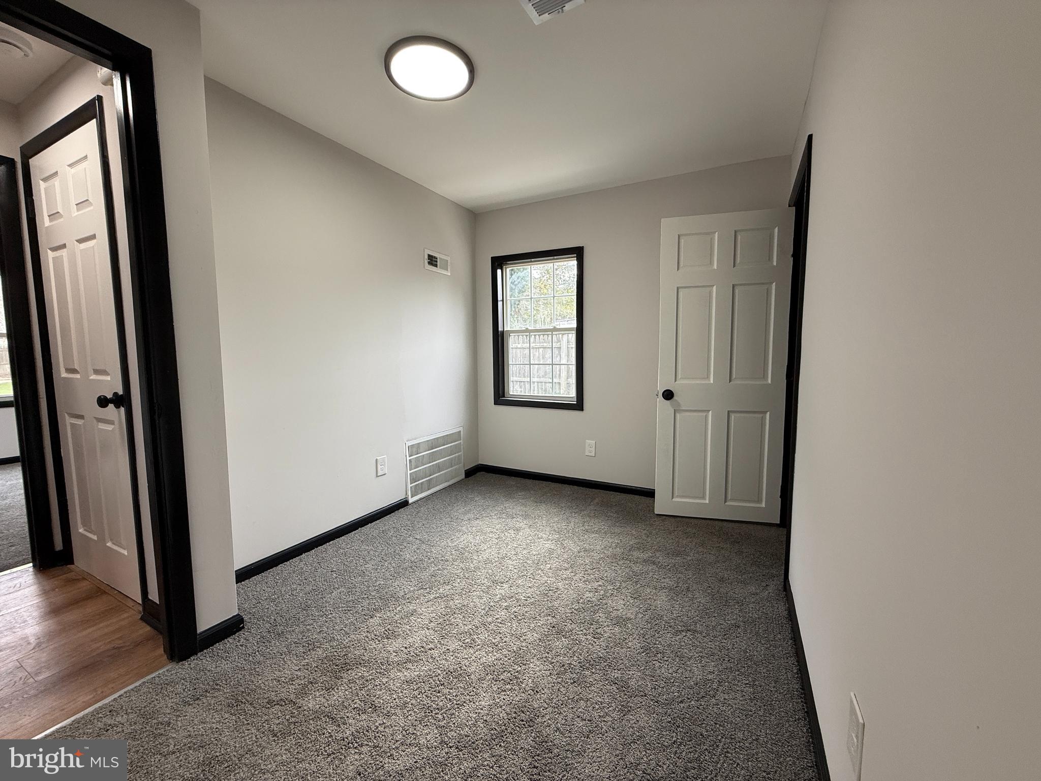 11 Sunset Lane Bridgeton, NJ 08302 - Photo 12 of 16 an empty room with windows and closet