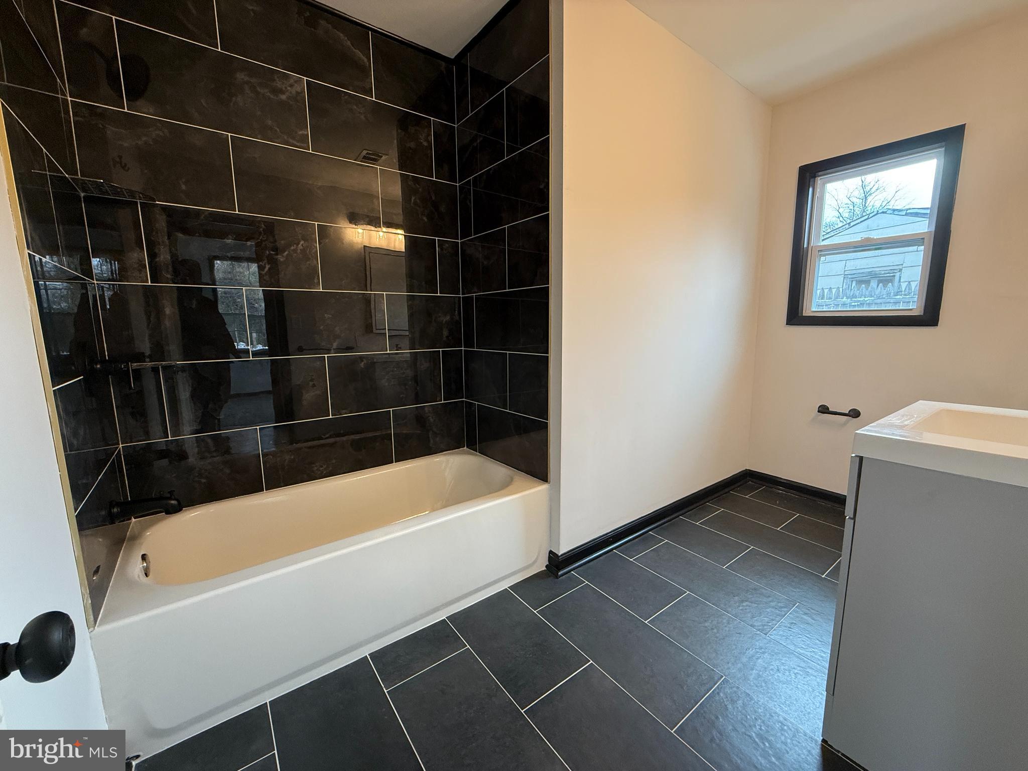 11 Sunset Lane Bridgeton, NJ 08302 - Photo 10 of 16 a bathroom with a bathtub and a shower