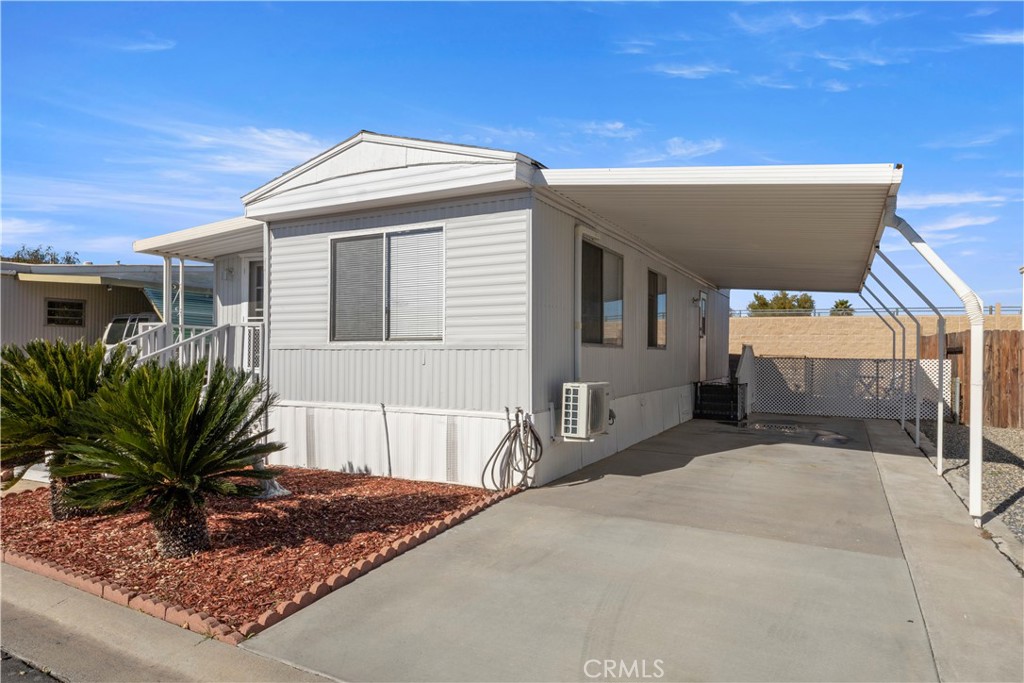 27150 Shadel Road, Unit 122 Menifee, CA 92586 - Photo 14 of 26 a front view of a house with a yard