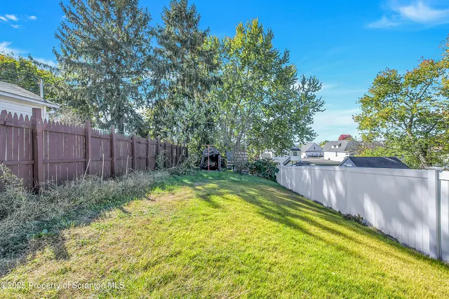 a view of swimming pool with a backyard
