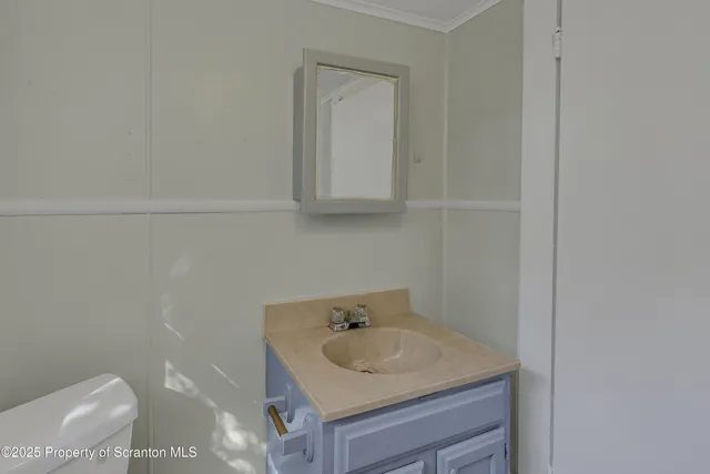 a bathroom with a sink and vanity