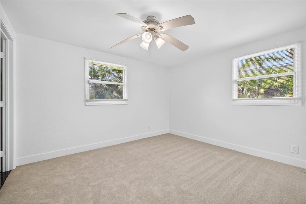 3225 West Shell Point Road Ruskin, FL 33570 - Photo 33 of 67 an empty room with a window and a fan