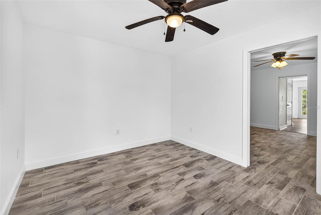 3225 West Shell Point Road Ruskin, FL 33570 - Photo 46 of 67 a view of a hallway with wooden floor and closet