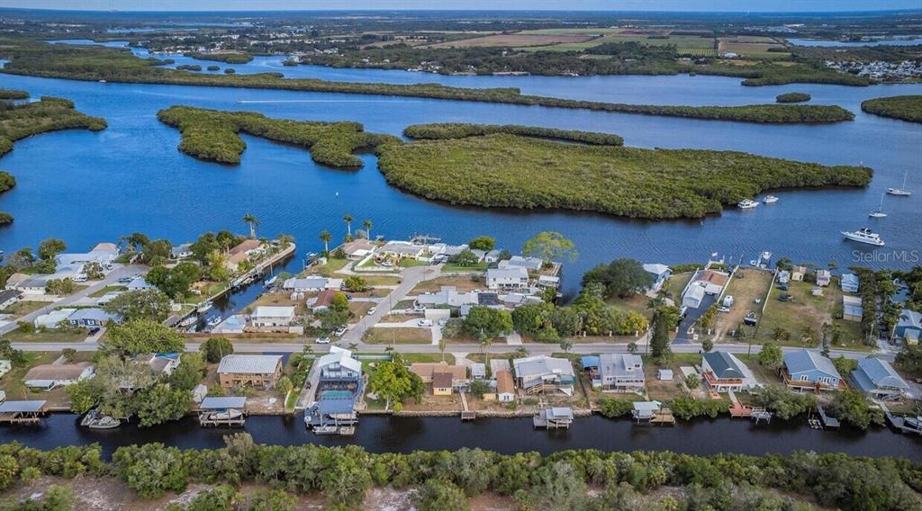3225 West Shell Point Road Ruskin, FL 33570 - Photo 66 of 67 an aerial view of a building with garden space and ocean view