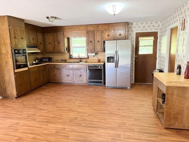 70 North Bellview Road Aragon, GA 30104 - Photo 11 of 30 a kitchen with stainless steel appliances a refrigerator sink and cabinets