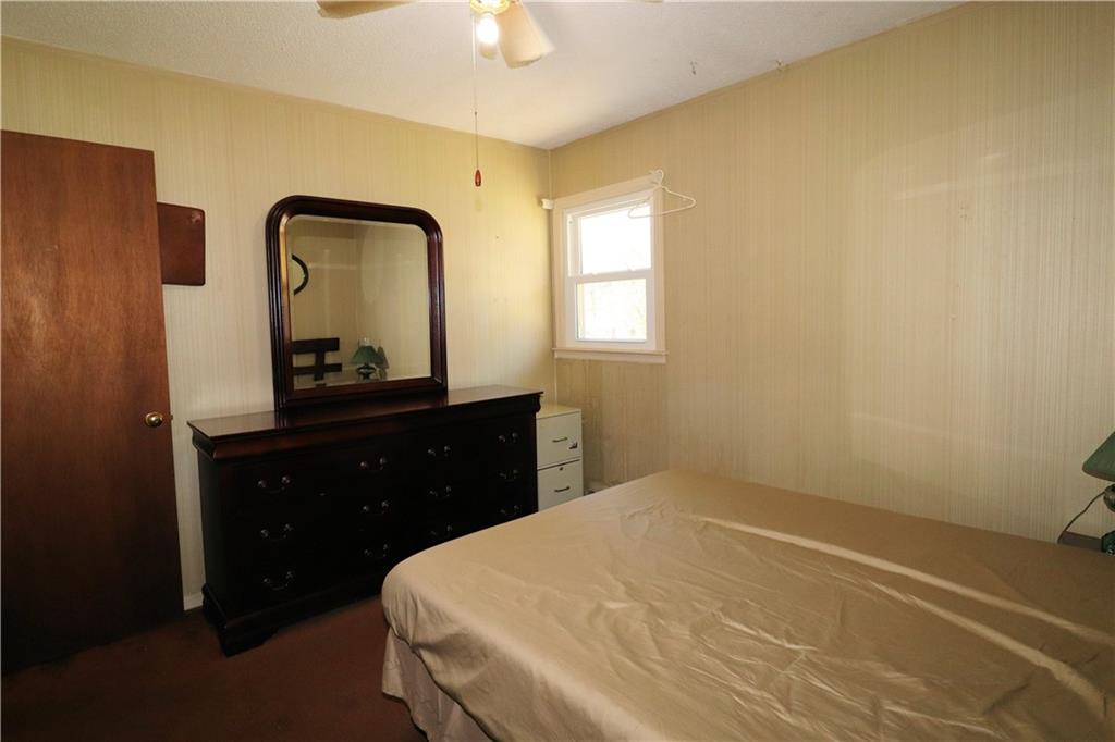 70 North Bellview Road Aragon, GA 30104 - Photo 12 of 30 a bedroom with a bed and a mirror on dresser