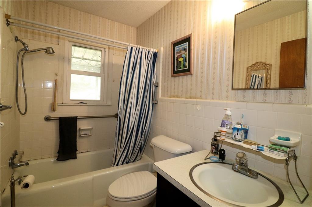 70 North Bellview Road Aragon, GA 30104 - Photo 15 of 30 a bathroom with a sink toilet a mirror and shower