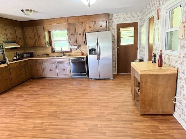70 North Bellview Road Aragon, GA 30104 - Photo 10 of 30 a large kitchen with stainless steel appliances granite countertop a stove a sink dishwasher and a refrigerator