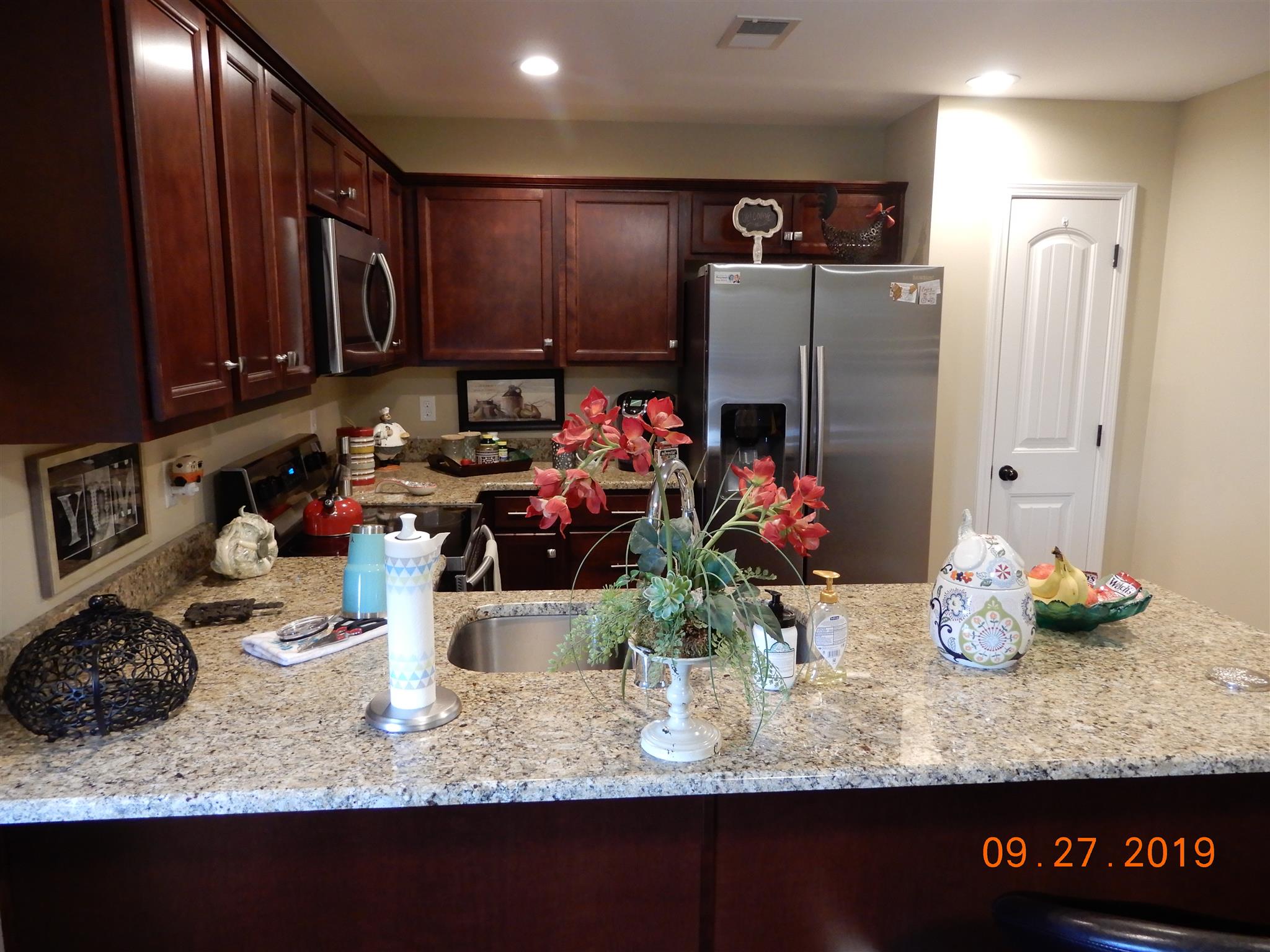 610 Murrell Road Dickson, TN 37055 - Photo 13 of 24 a kitchen with a refrigerator and a stove