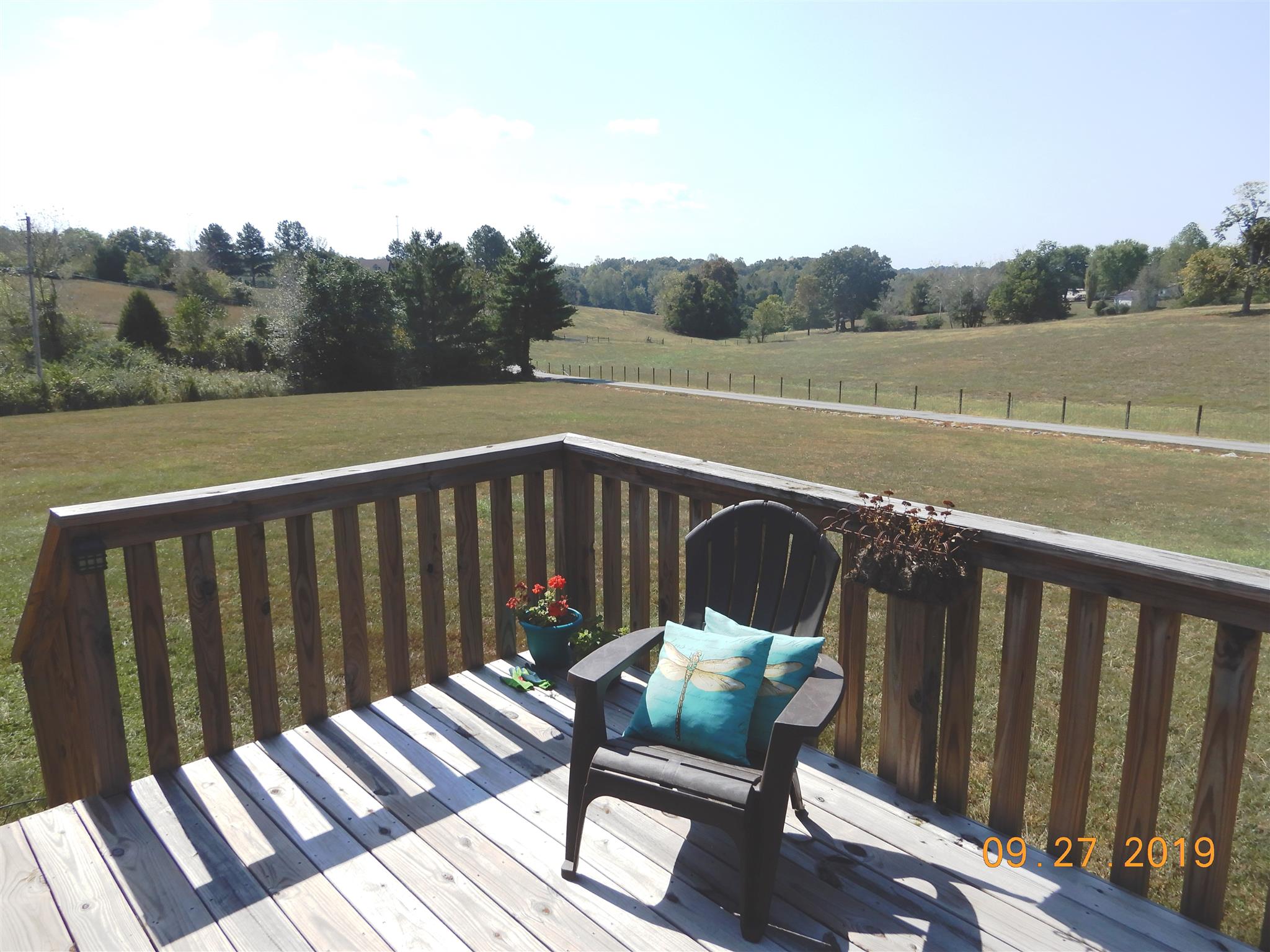 610 Murrell Road Dickson, TN 37055 - Photo 16 of 24 a view of a wooden deck and a yard