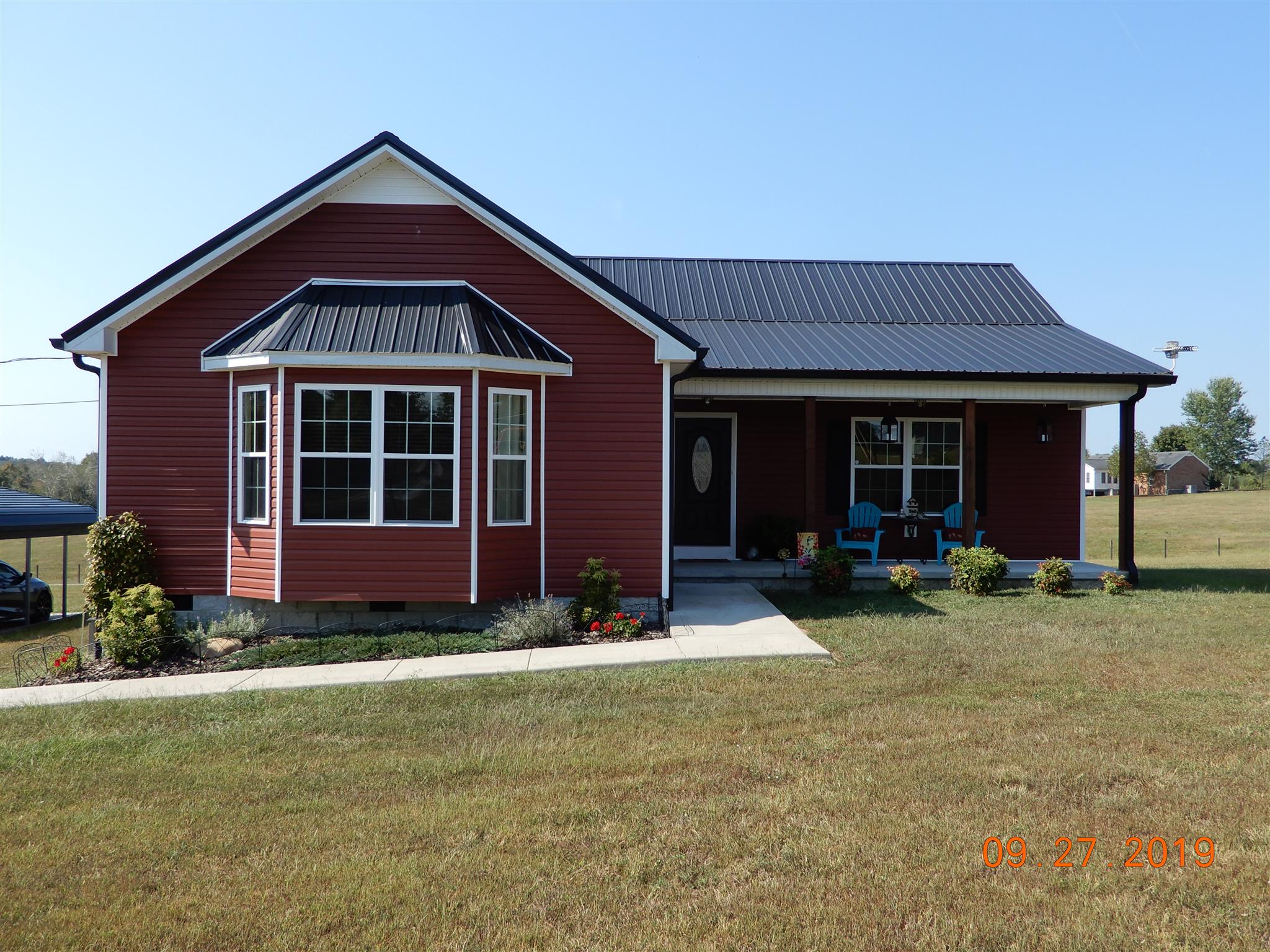 610 Murrell Road Dickson, TN 37055 - Photo 17 of 24 a front view of a house with a yard and porch