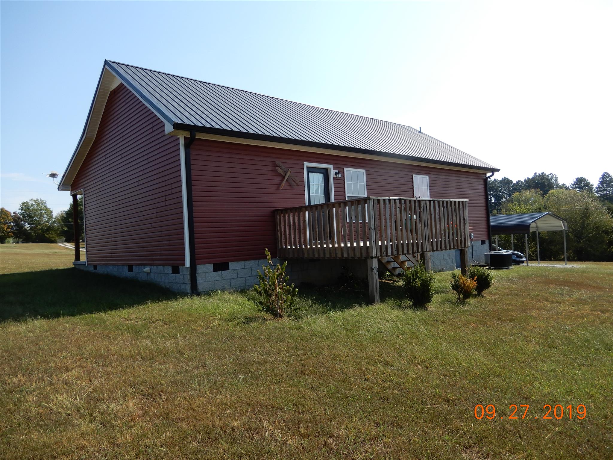610 Murrell Road Dickson, TN 37055 - Photo 19 of 24 a view of a house with a yard