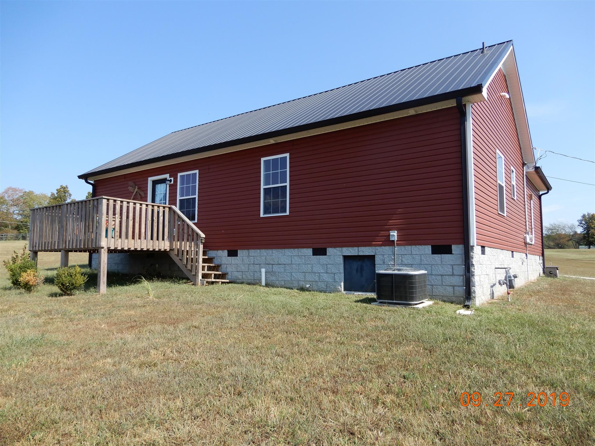610 Murrell Road Dickson, TN 37055 - Photo 21 of 24 a front view of a house with a yard
