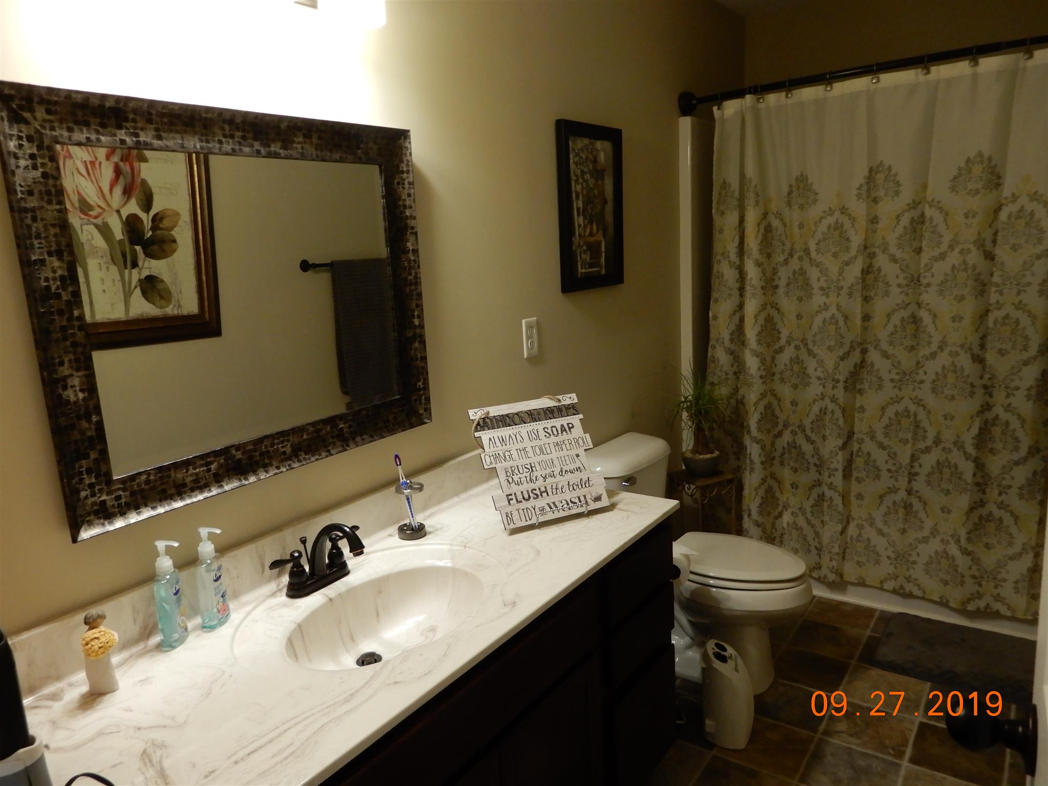 610 Murrell Road Dickson, TN 37055 - Photo 9 of 24 a bathroom with a sink and a mirror