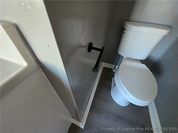 a bathroom with a toilet and a sink