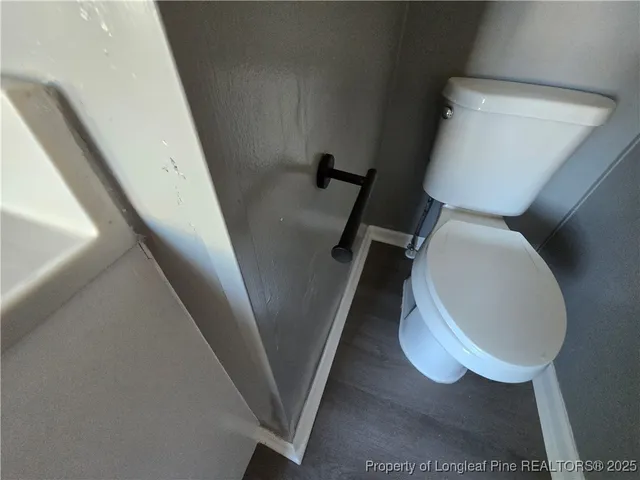 a bathroom with a toilet and a sink