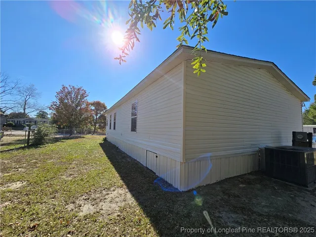 a view of a backyard of the house