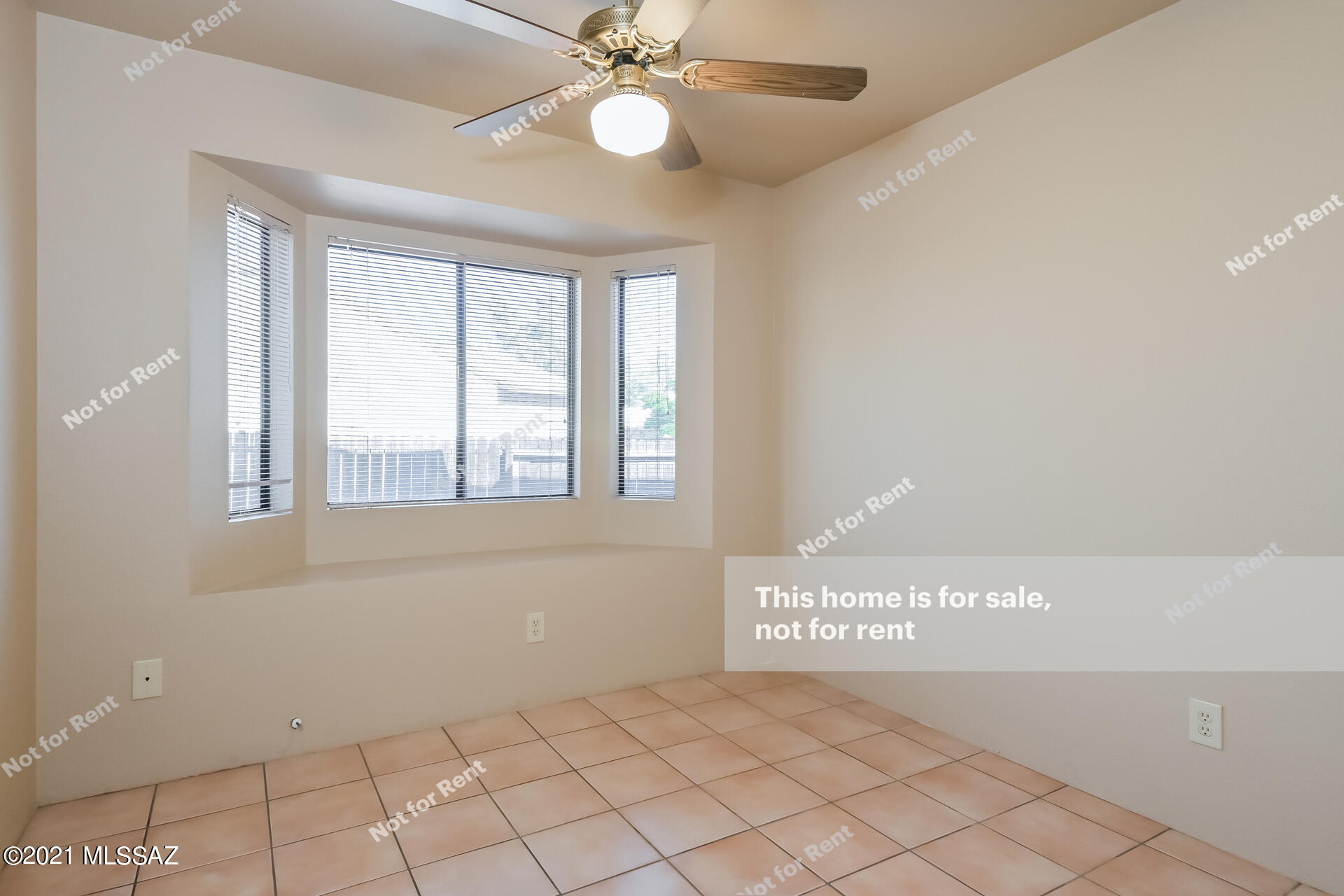 2757 West Firebrook Road Tucson, AZ 85741 - Photo 18 of 25 a view of an empty room with window and chandelier fan