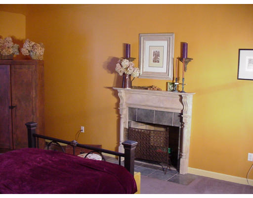 357 Central Street Georgetown, MA 01833 - Photo 12 of 21 a bedroom with a bed and a table