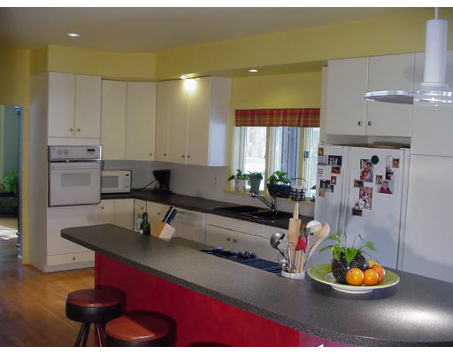 357 Central Street Georgetown, MA 01833 - Photo 4 of 21 a kitchen with a refrigerator and a stove