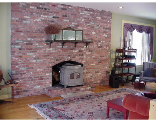 357 Central Street Georgetown, MA 01833 - Photo 10 of 21 a room with a fireplace
