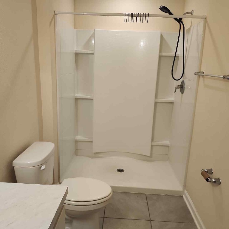 86624 Shortline Circle Yulee, FL 32097 - Photo 23 of 31 a bathroom with a toilet and a shower