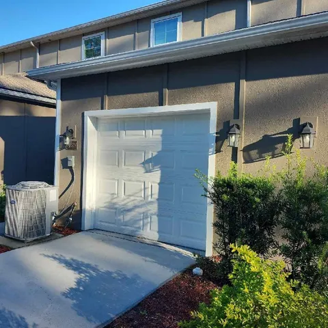a front view of a house with parking