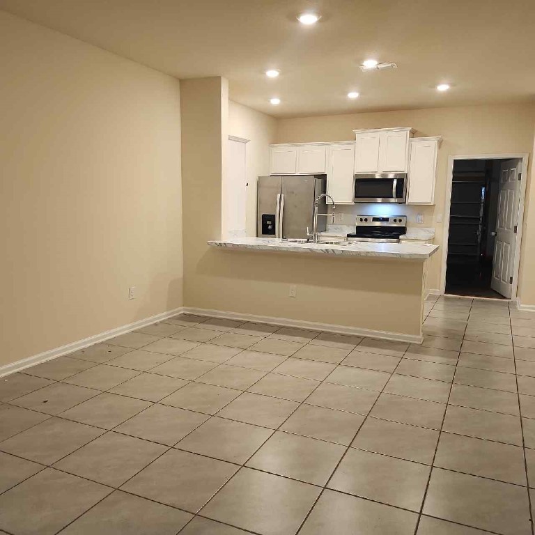 86624 Shortline Circle Yulee, FL 32097 - Photo 5 of 31 a view of kitchen with stainless steel appliances a refrigerator and a stove top oven