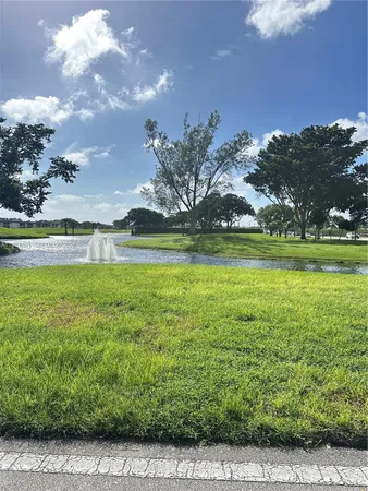a view of a golf course with a lake