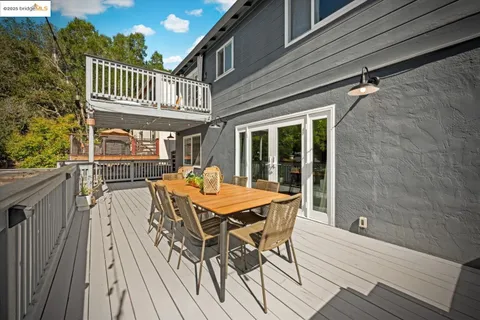 a bedroom with a large bed and a large window