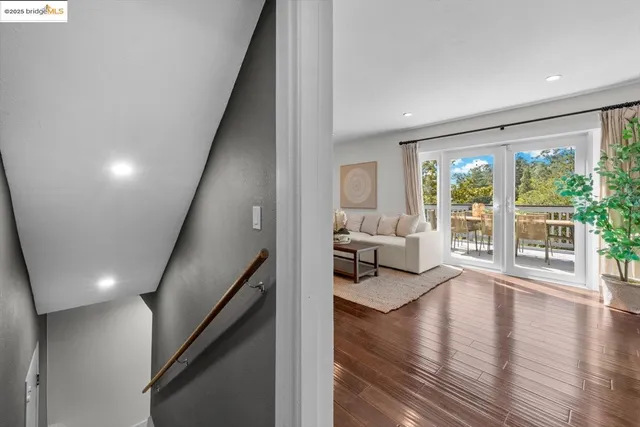 a view of a swimming pool with a patio and plants