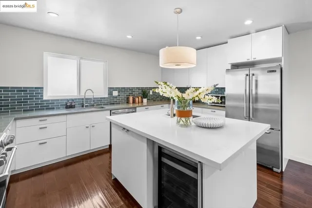 a kitchen with a sink cabinets and window