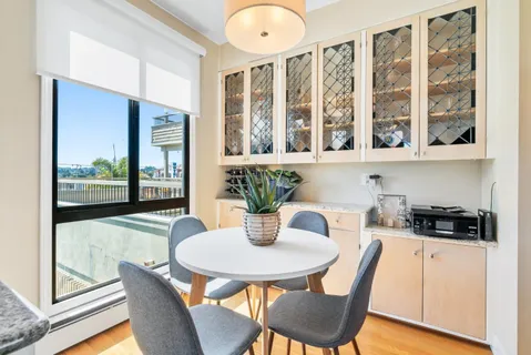 a kitchen with a table and chairs