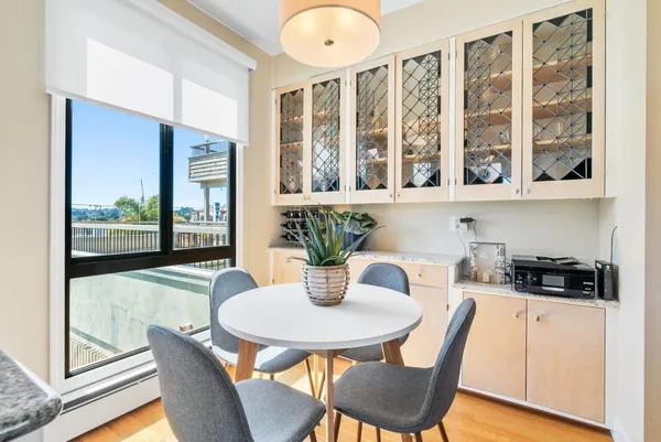 a kitchen with a table and chairs